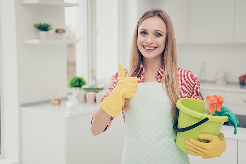 Woman with Cleaning Supplies